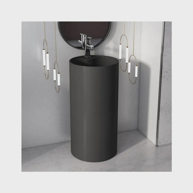 Modern Black Cylindrical Pedestal Sink with Chrome Faucet – Minimalist Bathroom Vanity with Round Mirror & Contemporary Pendant Lighting