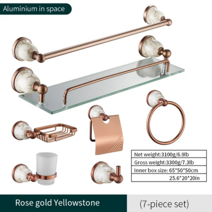 Rose gold bathroom accessory set with glass shelf, towel bar, and other fixtures on a white background.