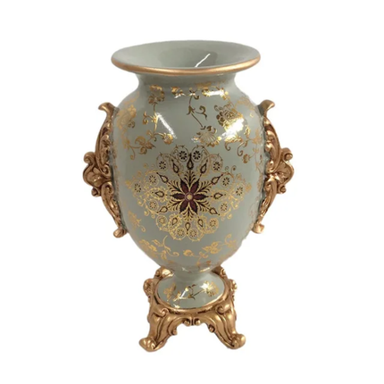 Decorative vase with gold floral patterns on a white background