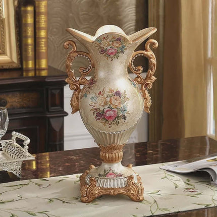 Decorative vase with floral patterns on a table in an elegant room.