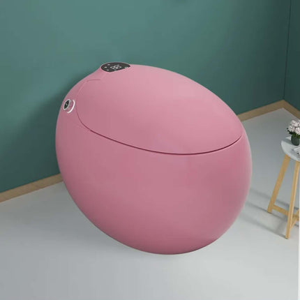 Pink spherical object with buttons on a teal wall background