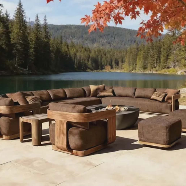 Outdoor patio furniture set with fire pit by a lake and forest