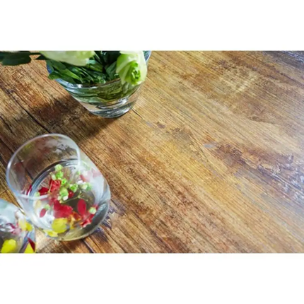 Clear glass containers with colorful contents on a wooden surface