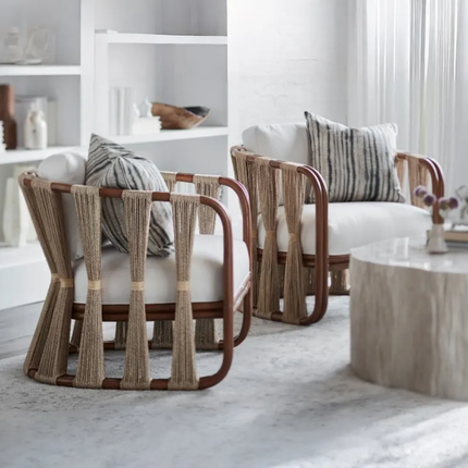 Modern living room with wicker chairs and a marble coffee table.