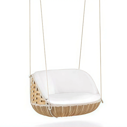 Wicker hanging chair with white cushion on a white background