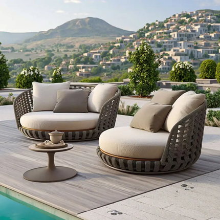 Outdoor patio furniture set with cushions by a pool, featuring a scenic background.