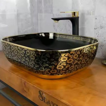 Lavabo noir et or avec comptoir en porcelaine à motif floral 