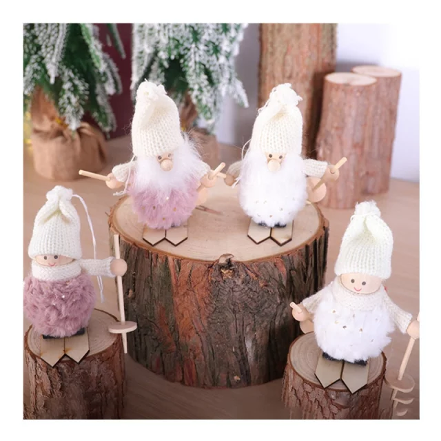 White angel ornaments with detailed design hanging on a festive Christmas tree