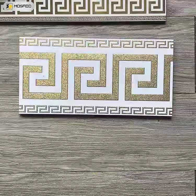 Box of Versace luxury tiles featuring a white and gold geometric pattern.