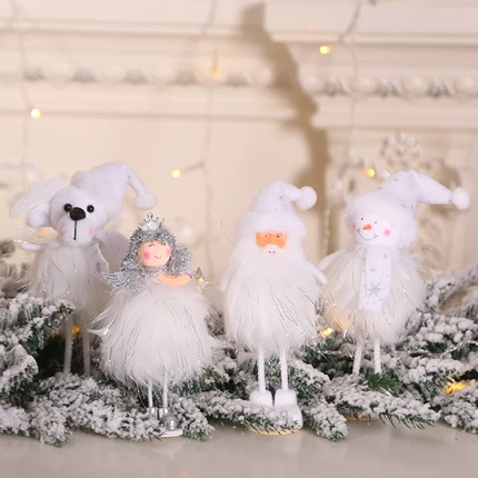 A set of decorative Christmas tree dolls featuring a snowman, Santa, an angel, and a bear with white fur, placed on a branch with snowflakes and Christmas lights in the background.