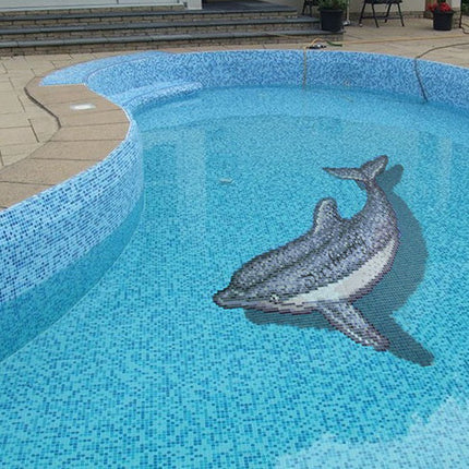Artistic glass mosaic pool tiles with a custom dolphin pattern – crafted from high-quality glass in different blue tones and grey/white shades for the dolphin, smooth finish that reflects light beautifully underwater, non-slip surface and easy to maintain