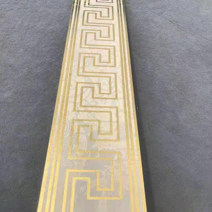 White and gold Versace-inspired border tiles measuring 12x60cm, luxury edition mosaic design perfect for high-end spaces, 12 tiles included per box
