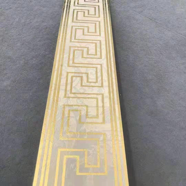 White and gold Versace-inspired border tiles measuring 12x60cm, luxury edition mosaic design perfect for high-end spaces, 12 tiles included per box