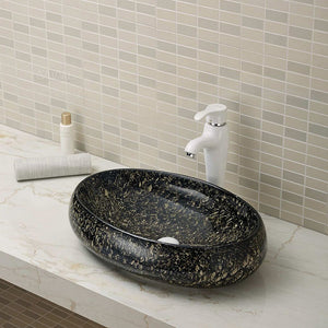 Glazed ceramic golden color wash basin in pubic