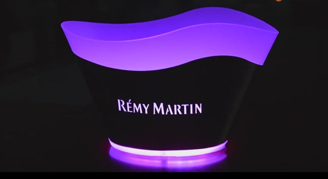 A purple ice bucket with a brand logo 'Remy Martin' on the front, featuring LED lights that change colors.